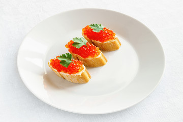 fish eggs on on white bread with butter 