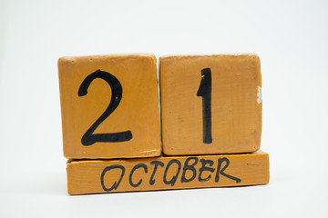 october 21st. Day 20 of month, handmade wood calendar isolated on white background. autumn month, day of the year concept