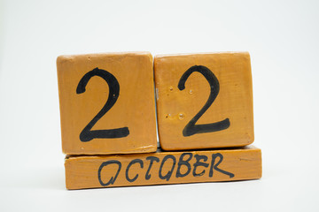 october 22nd. Day 22 of month, handmade wood calendar isolated on white background. autumn month, day of the year concept