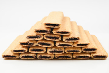 Waffle bar with jam isolated on white. Pyramid of waffers.