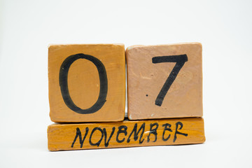 november 7th. Day 7 of month, handmade wood calendar isolated on white background. autumn month, day of the year concept