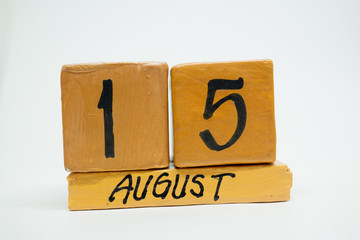august 15th. Day 15 of month, handmade wood calendar isolated on white background. summer month, day of the year concept