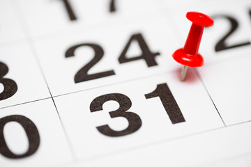 Pin on the date number 31. The thirty first  day of the month is marked with a red thumbtack. Pin...