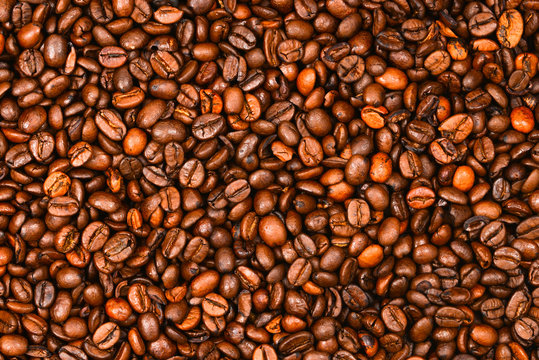 Coffee beans background. Top view. Coffee beans texture. © Nikolay