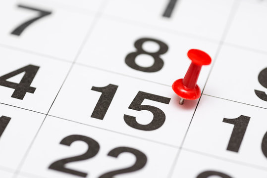 Pin on the date number 15. The fifteenth day of the month is marked with a red thumbtack. Pin on calendar
