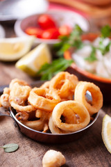 Crispy calamari rings on a rustic table