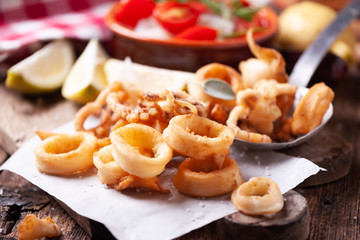 Crispy calamari rings on a rustic table