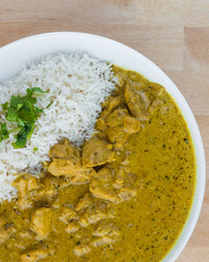Indian food. Green chicken curry with basmati rice