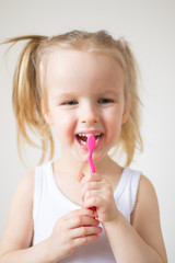 Happy Little Girl Brushing Her Teeth, Pink Toothbrush, Dental Hygiene, Morning Night Healthy Concept Lifestyle