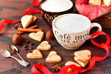 romantic morning: two cups of coffee with cookies in the shape of hearts, on the cookie letters...