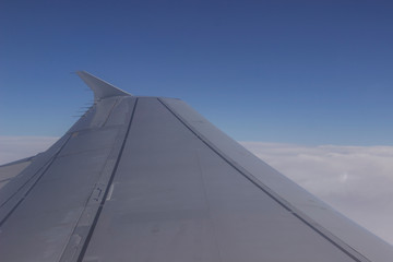 Fototapeta na wymiar view of wing of an airplane in the sky