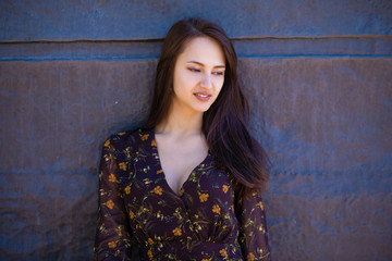 Fototapeta premium Beautiful brunette woman in sexy brown dress
