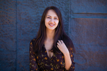 Naklejka premium Beautiful brunette woman in sexy brown dress