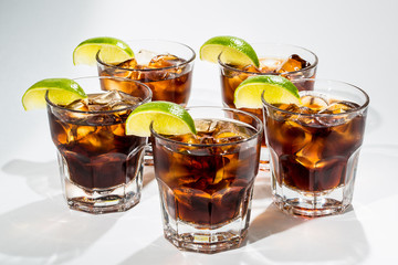 rum with Cola and lemon white background