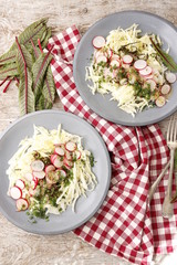 Vegetarian salad of radish, cabbage and sorrel. Vertical.