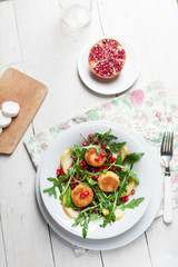 Goat cheese, garden rocket and pomegranate salad.