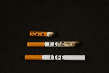 Cigarettes on a black background.  World No Tobacco Day. Stop smoking. stop cigarettes and nicotine