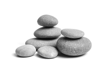 Group of smooth grey stones. Sea pebble. Stacked pebbles isolated on white background