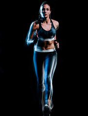 Fototapeta na wymiar one beautiful caucasian mixed race woman unner jogger jogging running in studio isolated on black background