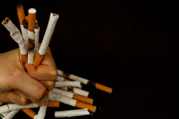 Cigarettes on a black background.  World No Tobacco Day. Stop smoking. stop cigarettes and nicotine
