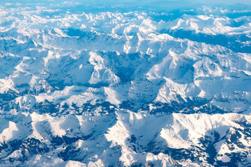 Fototapeta na wymiar Aerial view of alps mountains covered with snow. Bird Eye View, Austria