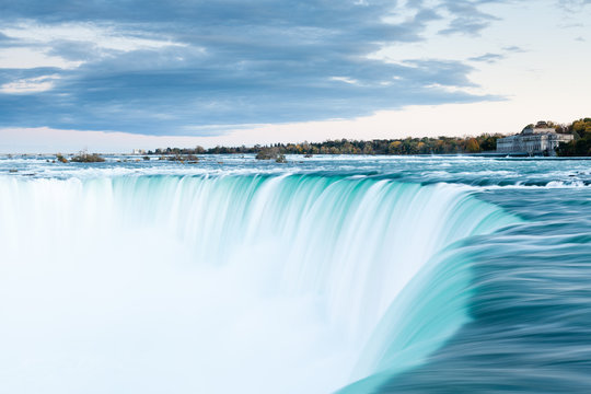 The view across the Horseshoe Falls at dusk, a part of the Niagara Falls, viewed from the Canadian side.  The falls straddle the border between America and Canada.