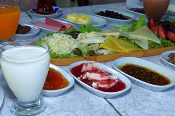 Traditional Turkish Breakfast with milk, cheese, marmelade,butter,orange juice