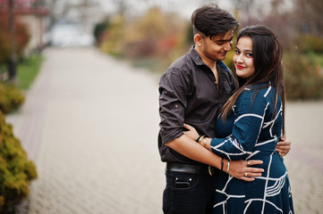 Love story of indian couple posed outdoor.