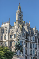 View at the Dom Pedro IV statue and classic building on background