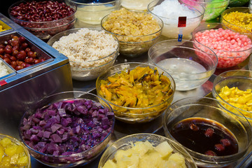 Topping mixed for Thai ice dessert. Thai sweet dessert (Khanom Thai). Colorful thai Sweet dessert. Topping for ice cream or shaved ice.Street food local tradition .