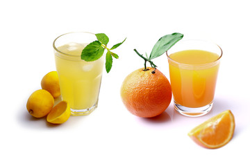 Glass of orange juice and lemonade isolated on white background