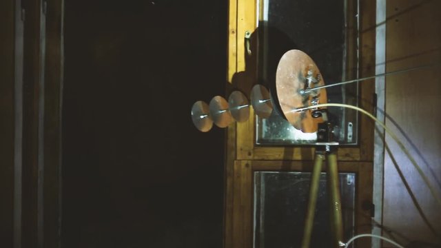 secret spy electromagnetic emitter. special services antenna, sound cannon from a building window.