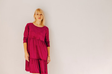 attractive stylish young girl near the window in light interior