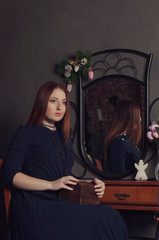 Young happy woman with casket and jewelry