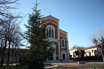 high church seen from the outside. walls painted in red and ocher. sacredness, tradition and...