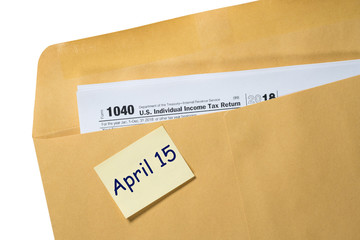 Printed copy of Form 1040 for income tax return for 2018 with reminder for April 15, 2019 deadline