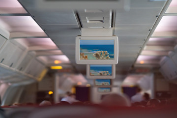 Inside an airplane cabin during a flight