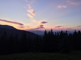 Heaven and earth in the evening sunset in the Ukrainian mountains