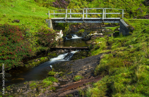 Small Wooden Bridge Over Wild Creek On The Isle Of Skye In Small Wooden Bridge Over Wild Creek On The Isle Of Skye In