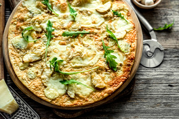 Pizza four cheeses on the table