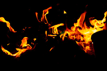 Fototapeta na wymiar Flame of fire on a black background
