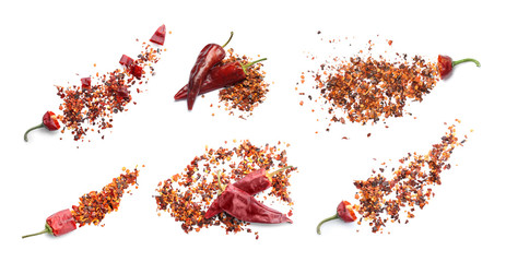 Set with chili pepper flakes on white background