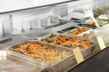 Containers with healthy food in school canteen