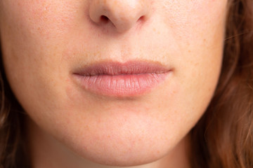 Closeup of a beautiful brunette woman's mouth