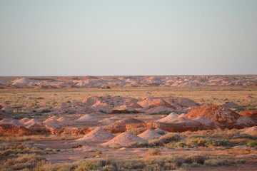 Tailings from deserted mine prospecting in the Australian outback opal mining town of Coober Pedy