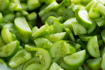 Many chopped cucumber for salad and cooking food, this Fresh Cucumber for mass street food vendor prepare for ready meal, background shadow selective focus