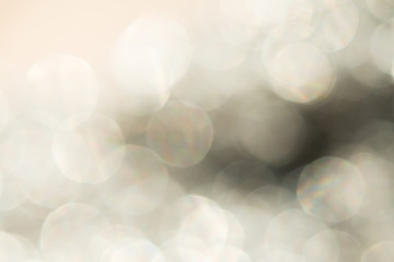 Golden Colorful blurred bokeh lights background. Abstract sparkles particle moving small large defocus different crystal plan shadow overlay blend screen modes, copy space for text logo