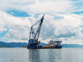 Oil rig in bay of tropical islands, exploration and production of oil in ocean