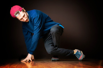 attractive male street dancer perform break dance footwork b
