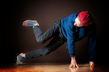 attractive male street dancer perform break dance footwork b